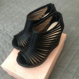 Black peep toe strapped wedge heel